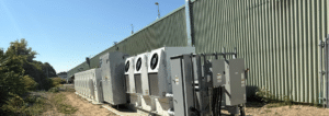 Row of industrial battery storage and electrical equipment installed at Judd Wire